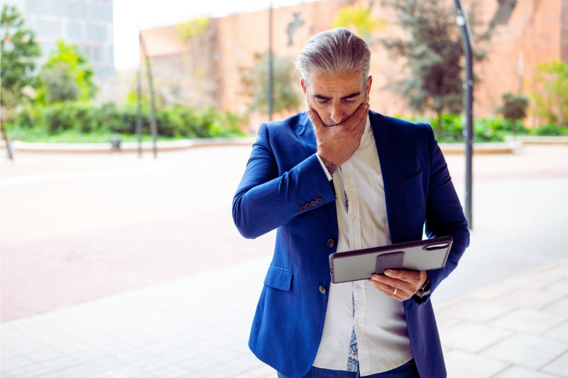concerned businessman receiving federal notice via email